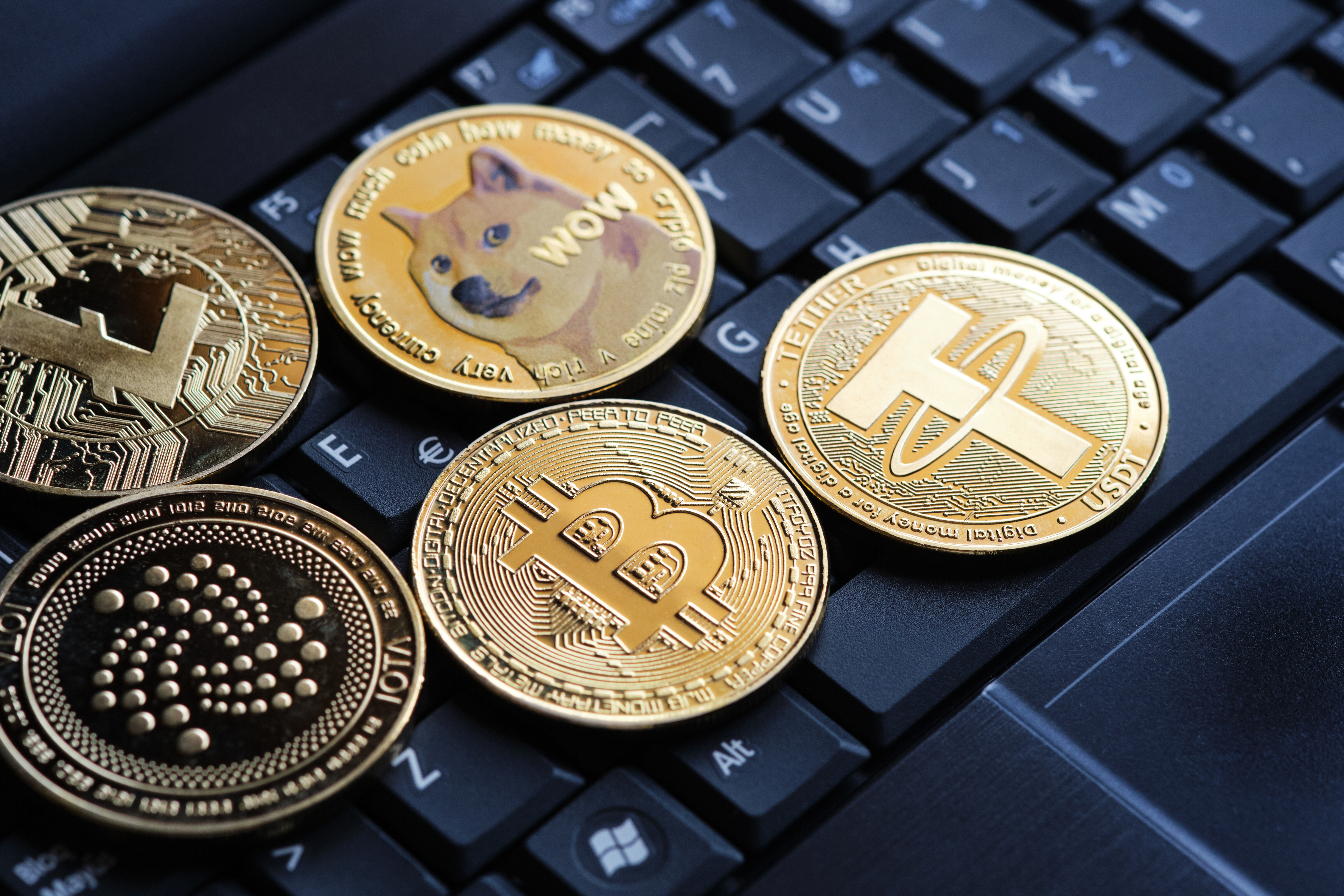 Various cryptocurrencies and laptop